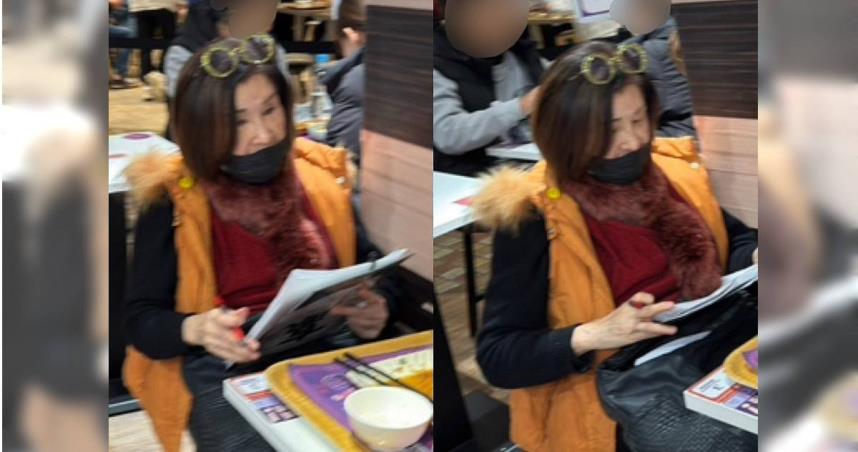 恬娃在百貨公司美食街看起厚厚一疊資料。（圖／讀者提供）